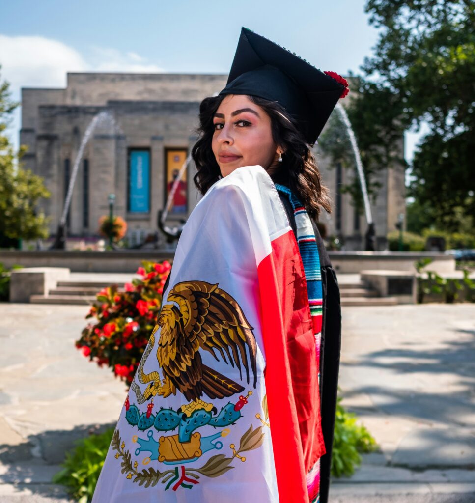 latina graduate with mexican flag